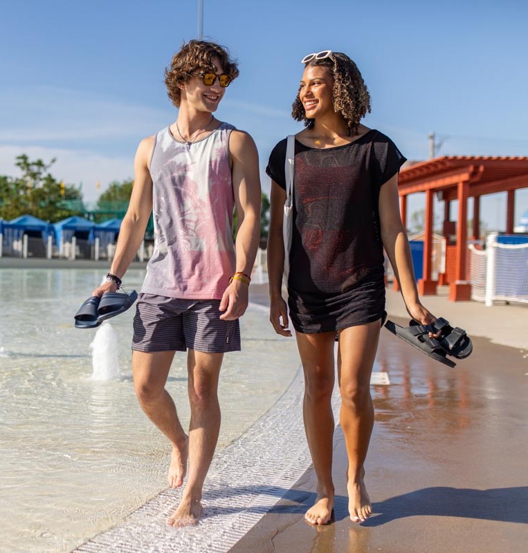 boy and girl walking on beach